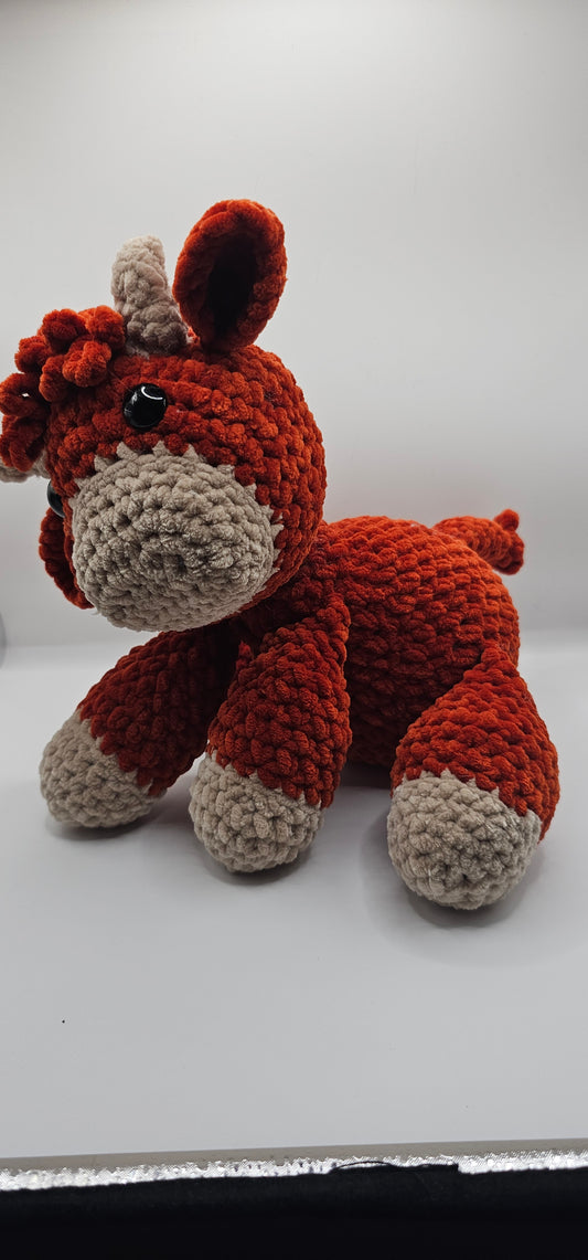 Sitzende highland Cow